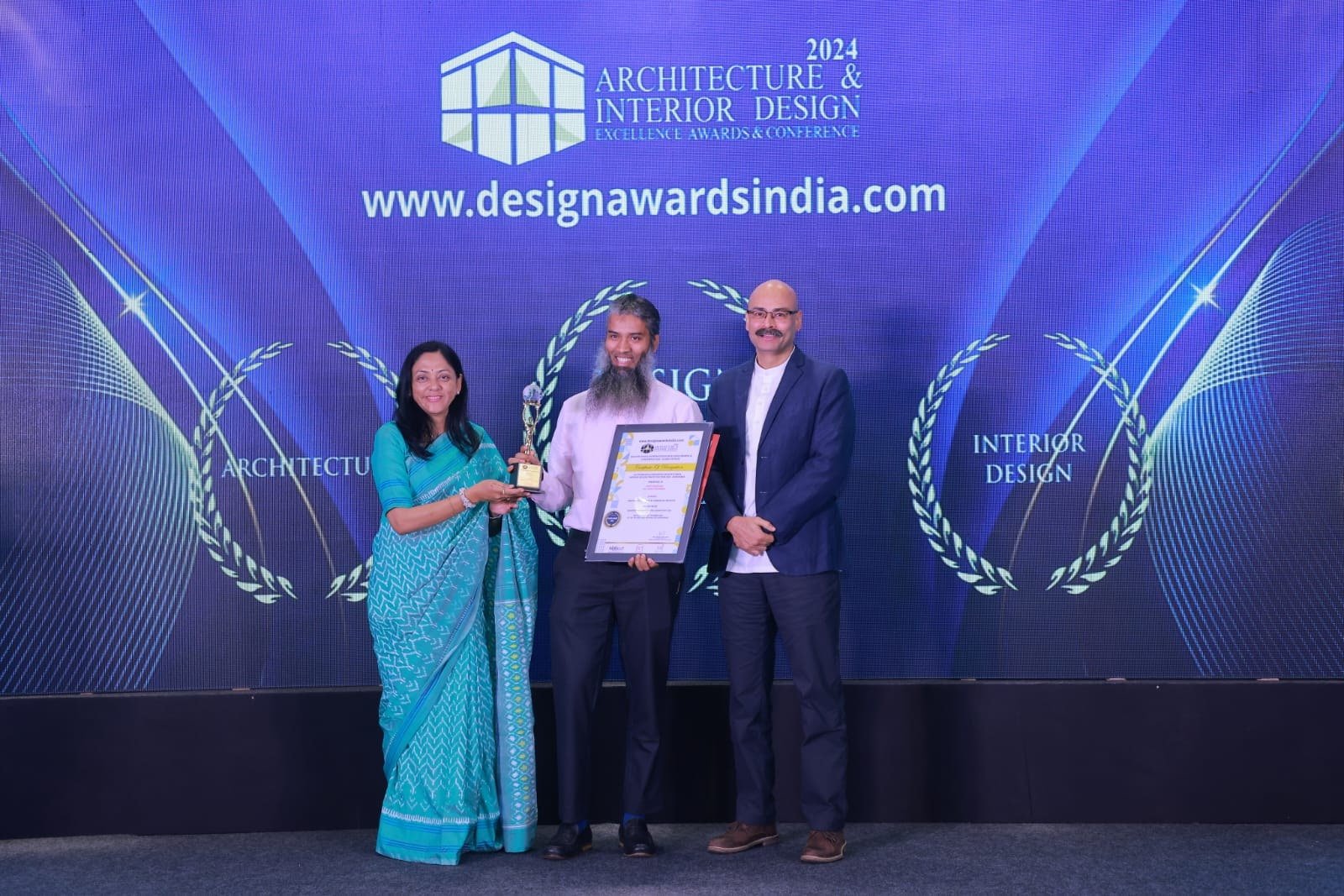 Ar. Umair Rehaman receiving the 2024 Architecture & Interior Design Excellence Award on stage at The Taj West End, Bengaluru